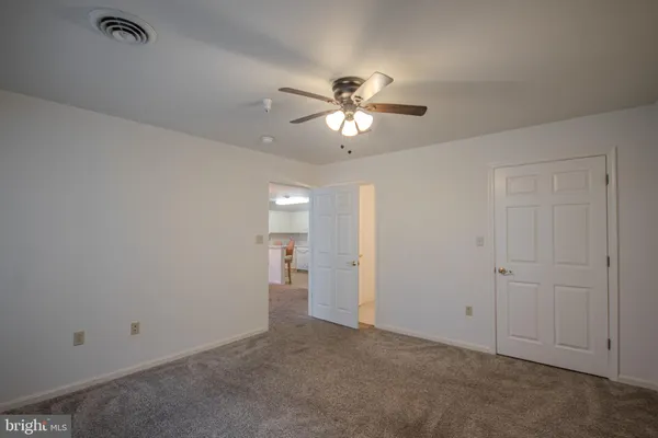 a bathroom with a sink vanity and toilet