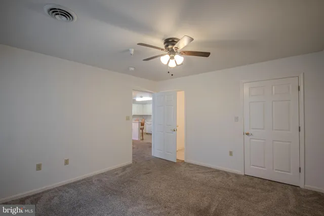 a bathroom with a sink vanity and toilet