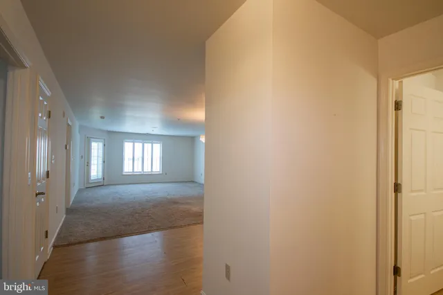 a view of a kitchen with a sink and a stove top oven
