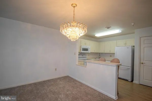 a view of a kitchen with a sink