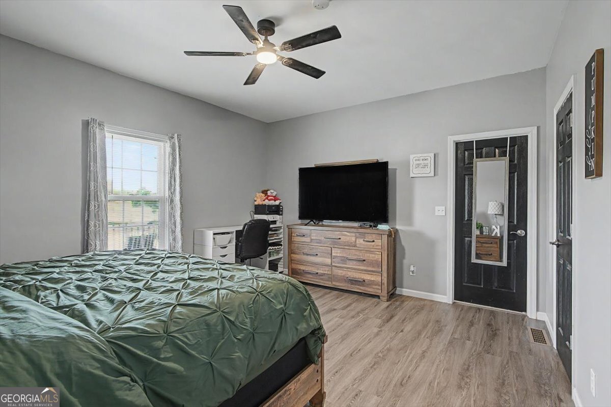 147 Edgar Bell Road Tallapoosa, GA 30176 - Photo 29 of 49 a bedroom with a bed and a flat screen tv