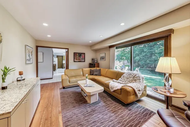 a living room with furniture and a lamp