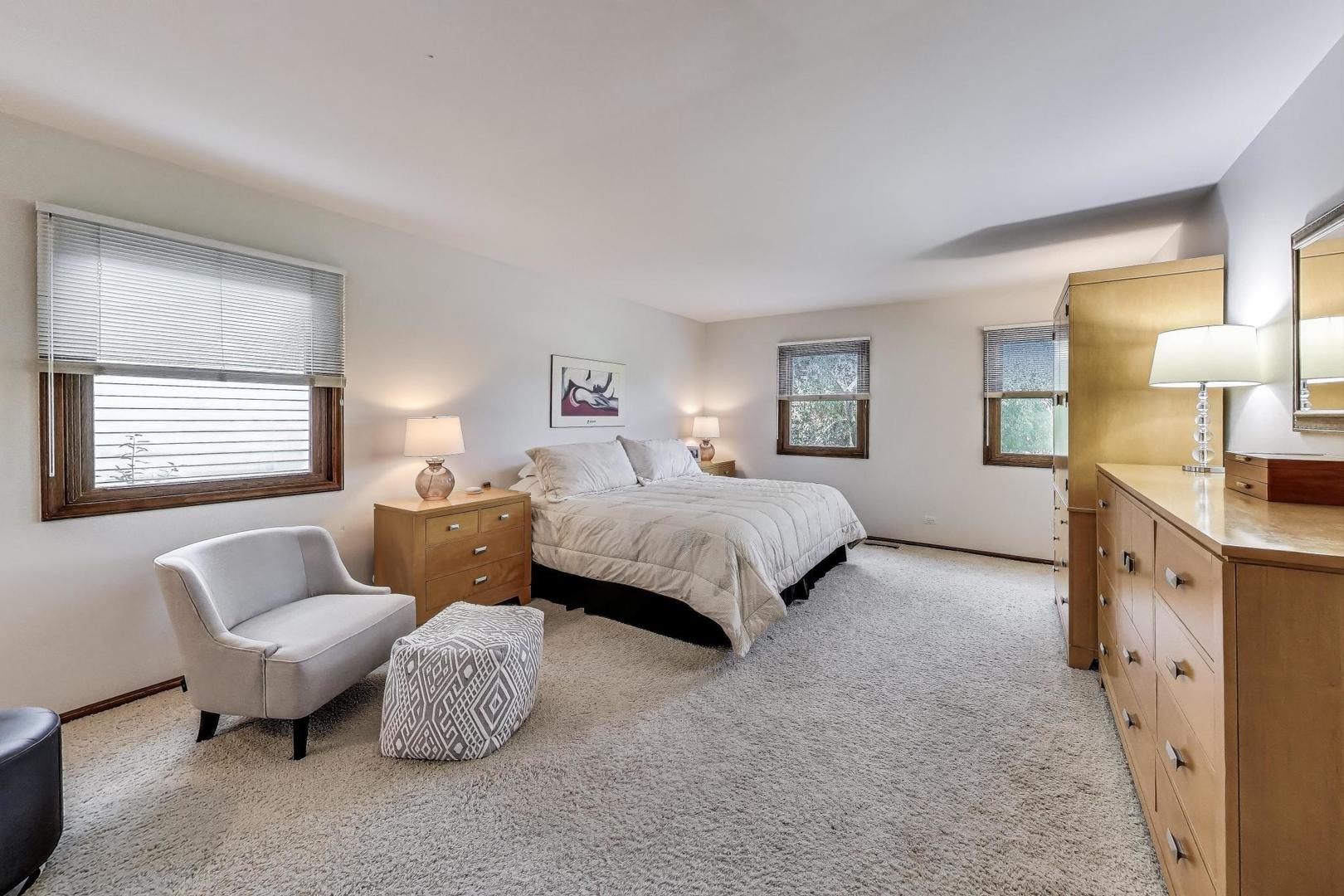 645 Ridge Road Highland Park, IL 60035 - Photo 14 of 32 a bedroom with furniture and a large window