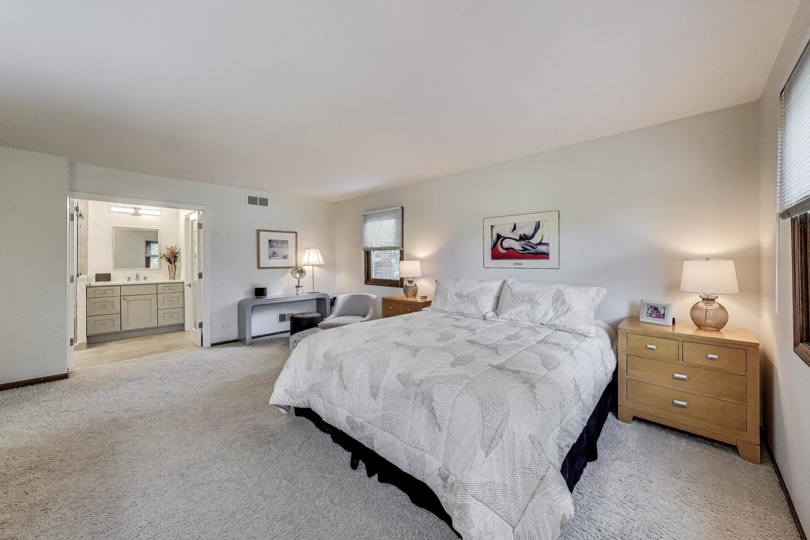 645 Ridge Road Highland Park, IL 60035 - Photo 15 of 32 a spacious bedroom with a bed and dresser
