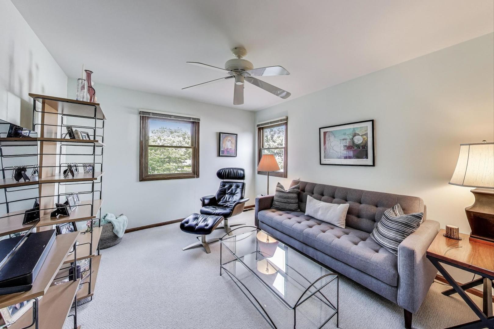 645 Ridge Road Highland Park, IL 60035 - Photo 19 of 32 a living room with furniture a rug and a window