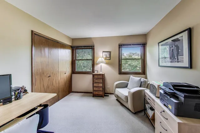 a bedroom with furniture and a window