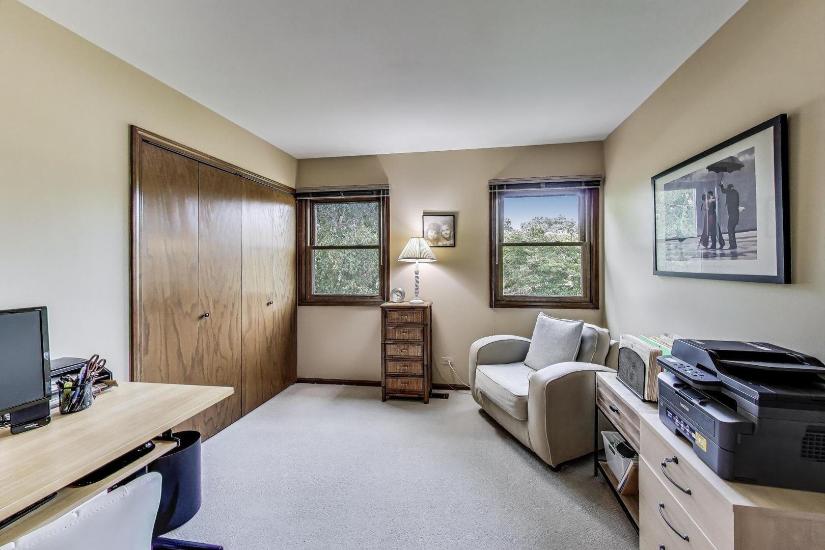 645 Ridge Road Highland Park, IL 60035 - Photo 20 of 32 a bedroom with furniture and a window