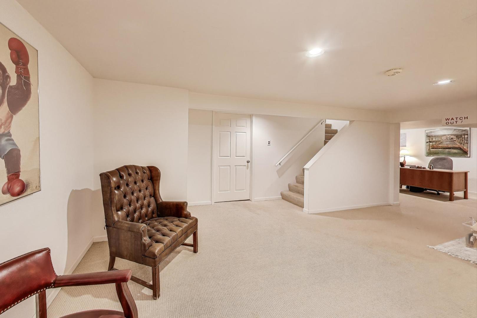 645 Ridge Road Highland Park, IL 60035 - Photo 22 of 32 a living room with furniture and a chair
