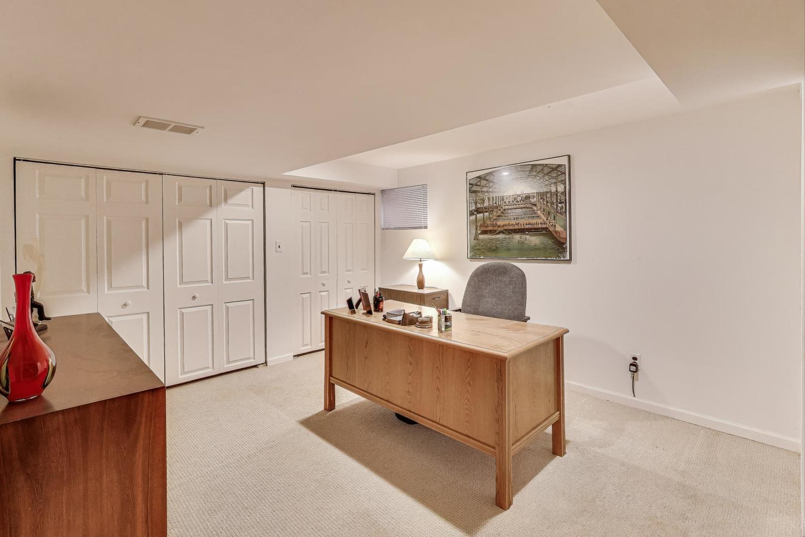 645 Ridge Road Highland Park, IL 60035 - Photo 23 of 32 a living room with furniture and a table