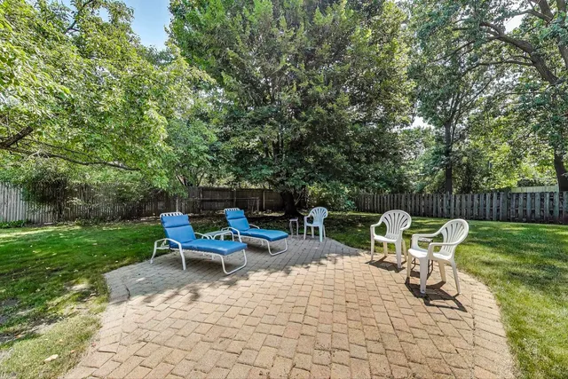 a view of backyard with outdoor seating