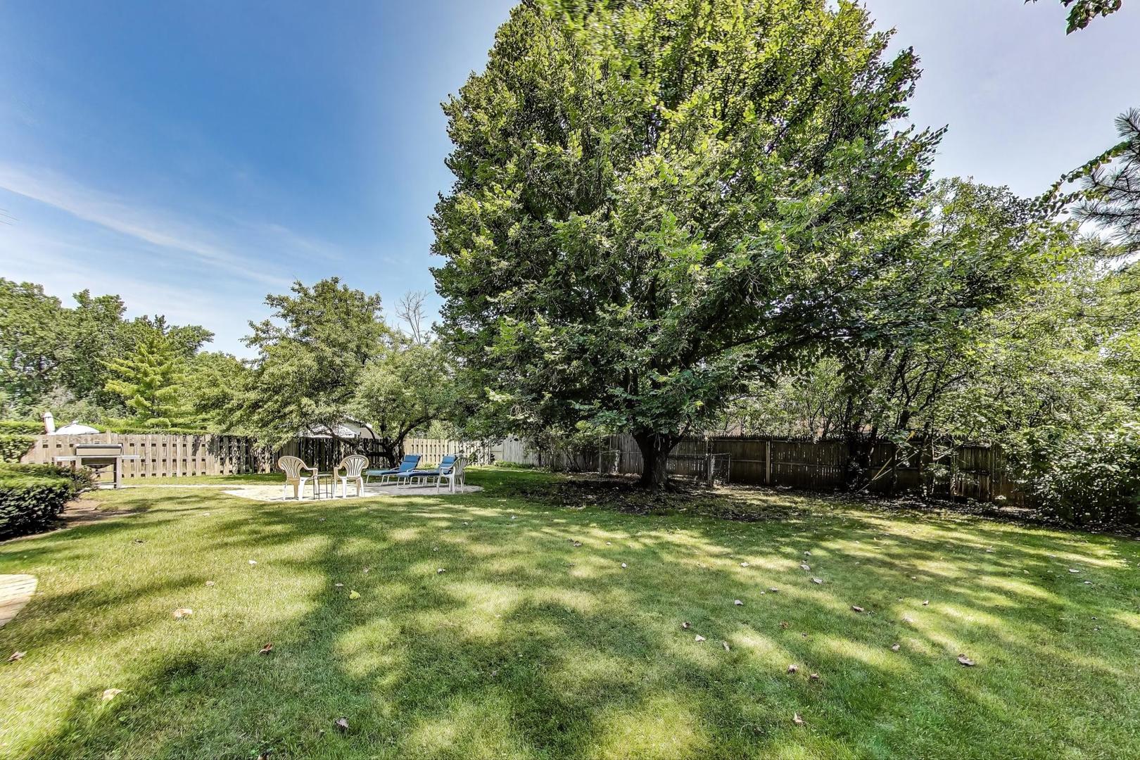 645 Ridge Road Highland Park, IL 60035 - Photo 28 of 32 a view of a backyard with a garden