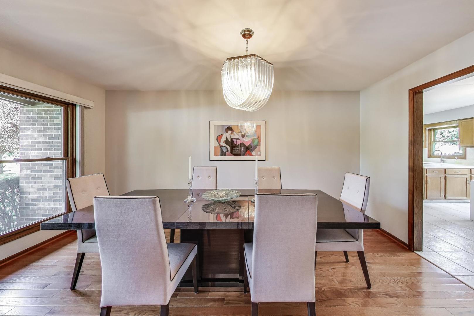 645 Ridge Road Highland Park, IL 60035 - Photo 6 of 32 a view of a dining room with furniture window and wooden floor