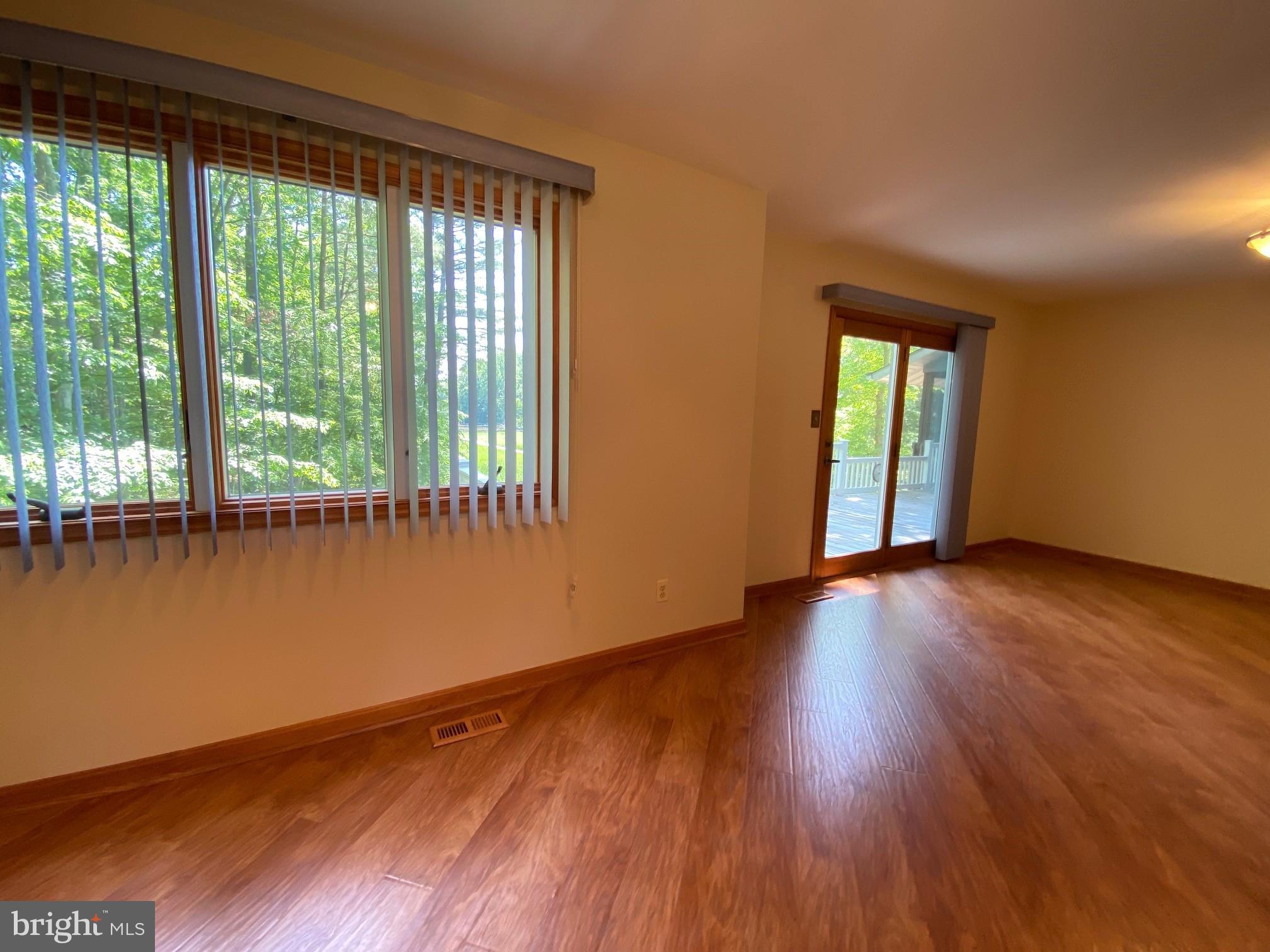 1320 Commodore Barney Road St. Leonard, MD 20685 - Photo 27 of 86 Breakfast area & dining with doors to deck
