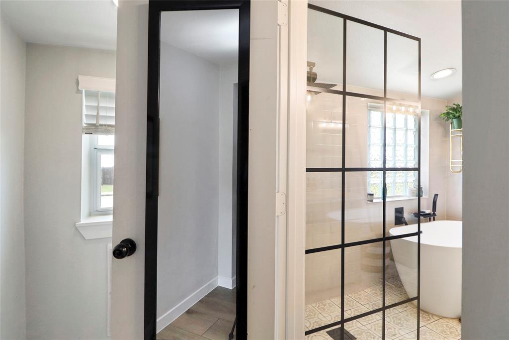 2408 Strader Road DISH, TX 76247 - Photo 17 of 40 a bathroom with a glass shower door