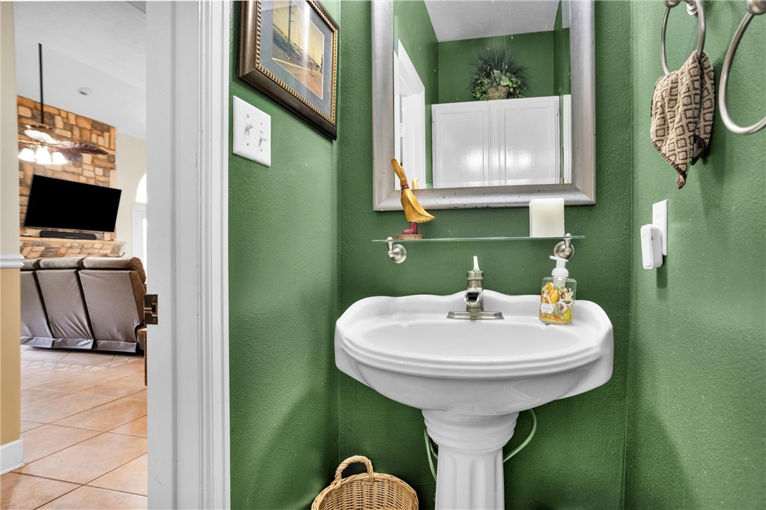 30820 Collier Smith Road Magnolia, TX 77354 - Photo 23 of 50 a bathroom with a sink and a mirror