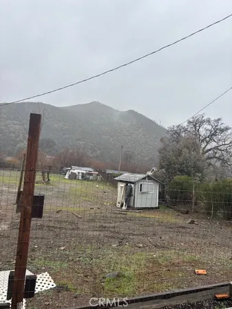 a view of a house with a dry yard