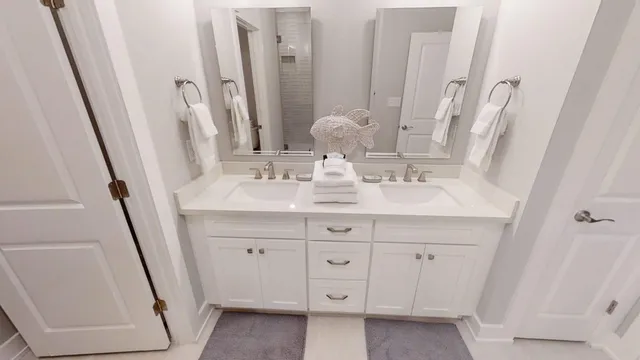 a bathroom with a double vanity sink and a mirror
