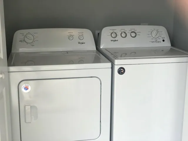 a utility room with dryer and washer