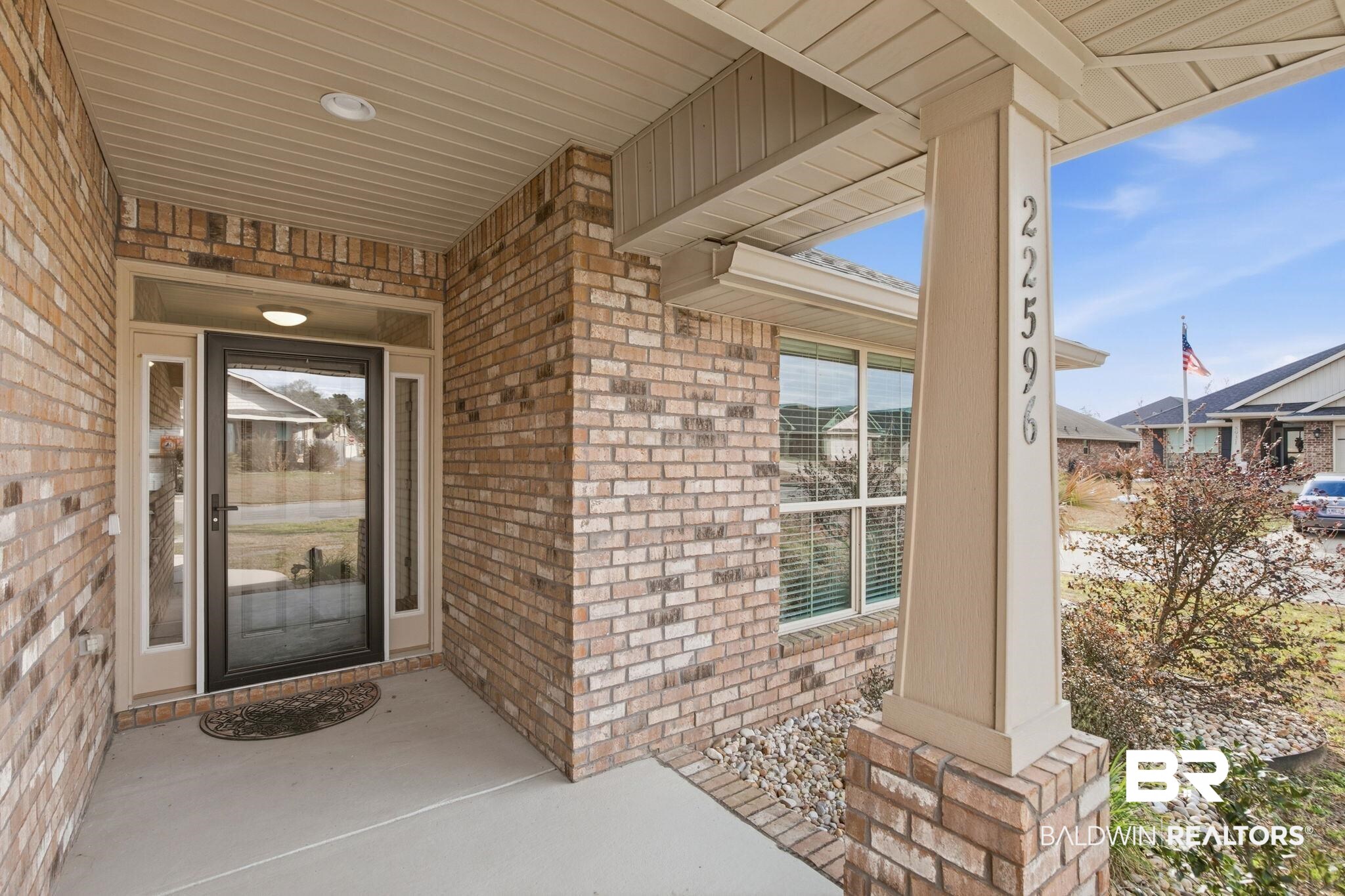 22596 Respite Lane Foley, AL 36535 - Photo 4 of 34 Doorway to property featuring brick siding and a porch