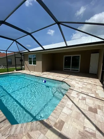 a view of house with backyard