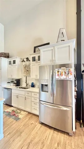 a kitchen with stainless steel appliances granite countertop a stove and a sink