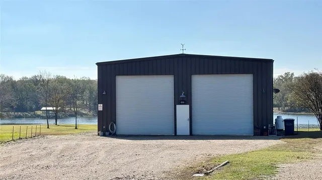 a front view of a house with a sitting area