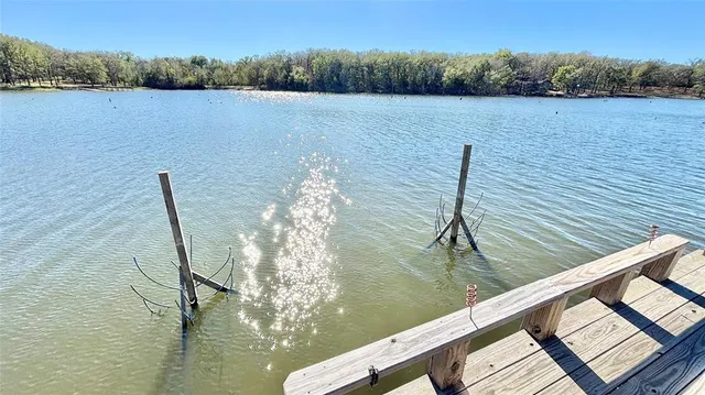 a view of a balcony with couch and wooden floor