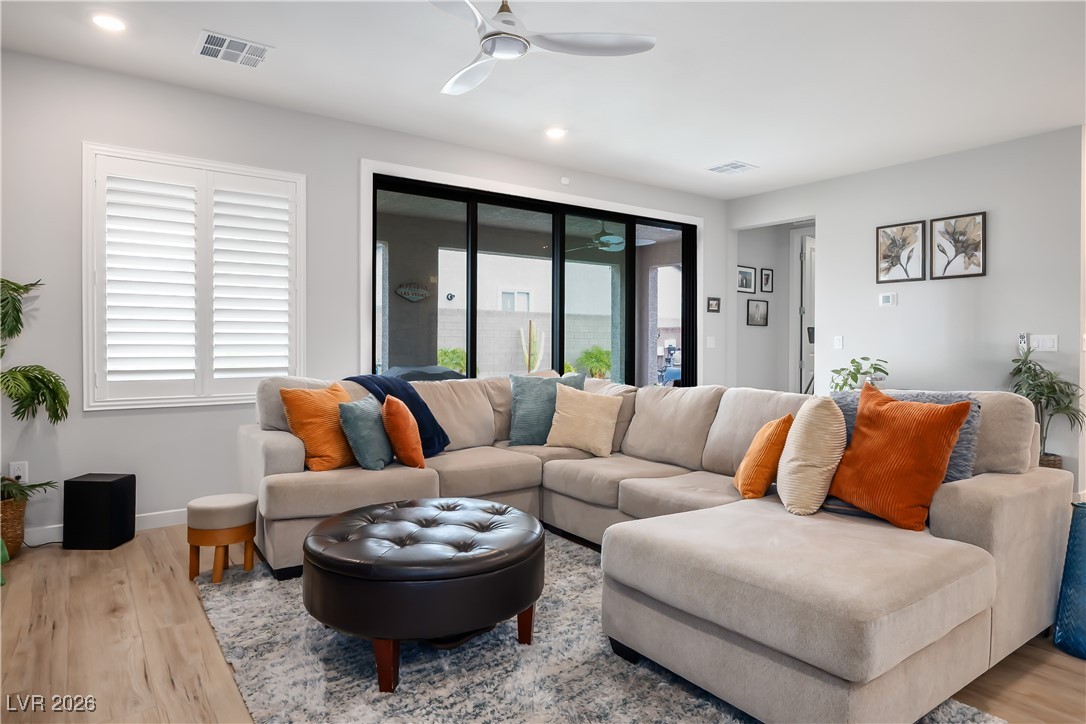 3018 Bounding Home Road North Las Vegas, NV 89086 - Photo 15 of 43 Living room with light wood-style flooring and ceiling fan