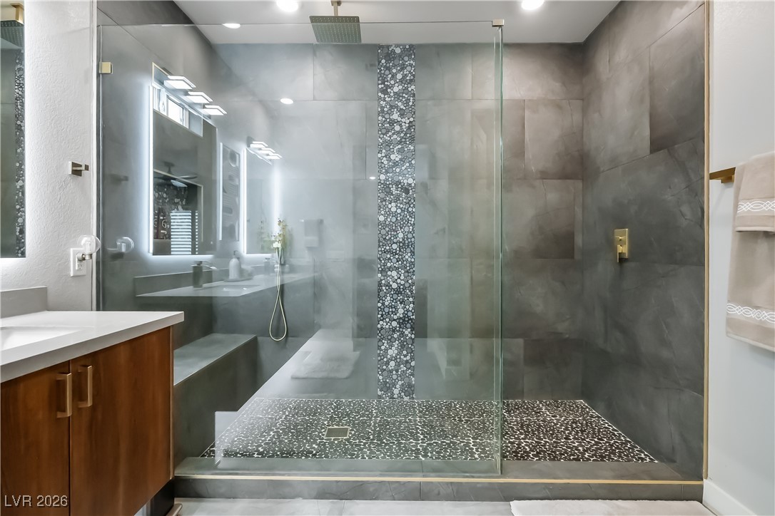 3018 Bounding Home Road North Las Vegas, NV 89086 - Photo 24 of 43 Full bath with vanity, a shower stall, and a textured wall