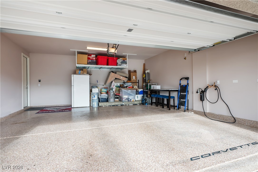 3018 Bounding Home Road North Las Vegas, NV 89086 - Photo 32 of 43 Garage with freestanding refrigerator and car charger