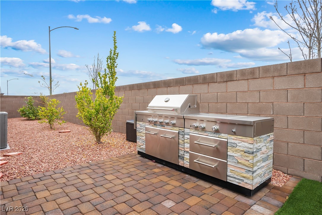3018 Bounding Home Road North Las Vegas, NV 89086 - Photo 34 of 43 Fenced backyard featuring area for grilling and a patio