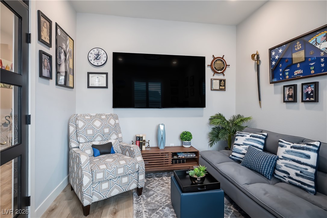 3018 Bounding Home Road North Las Vegas, NV 89086 - Photo 10 of 43 Living room featuring wood finished floors and baseboards