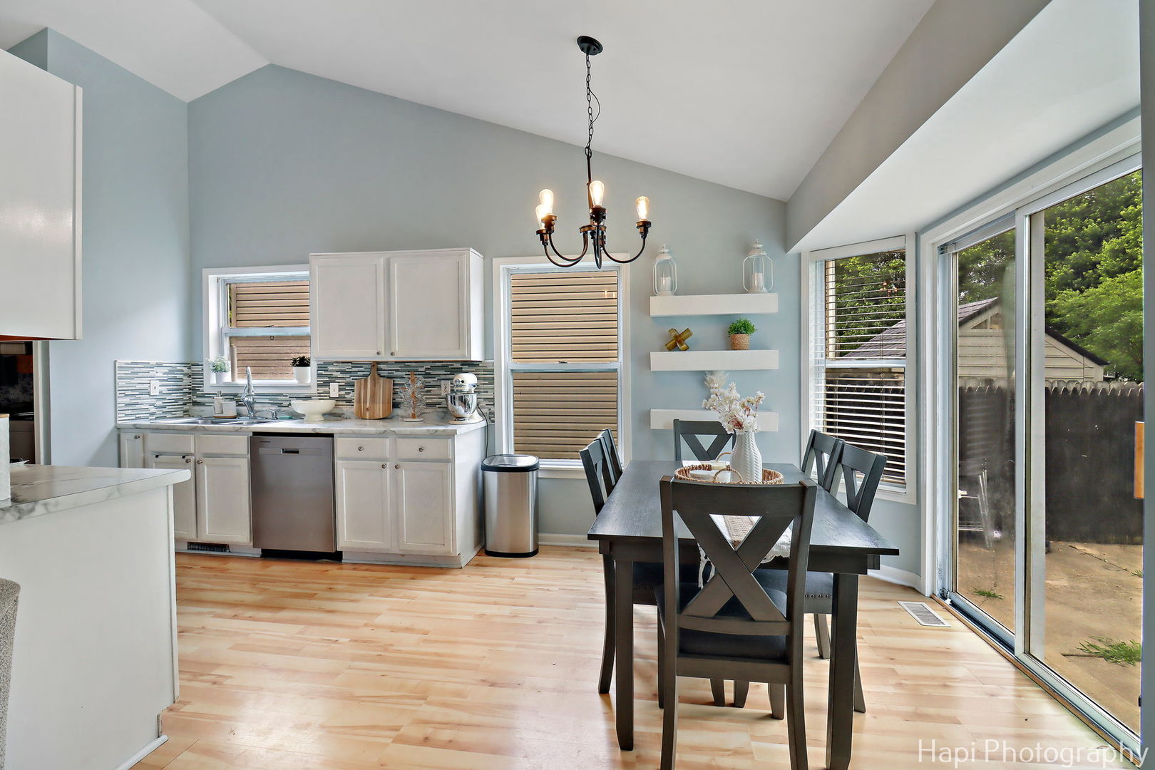 1504 9th Street Harvard, IL 60033 - Photo 5 of 24 a dining room filled chandelier and wooden floor