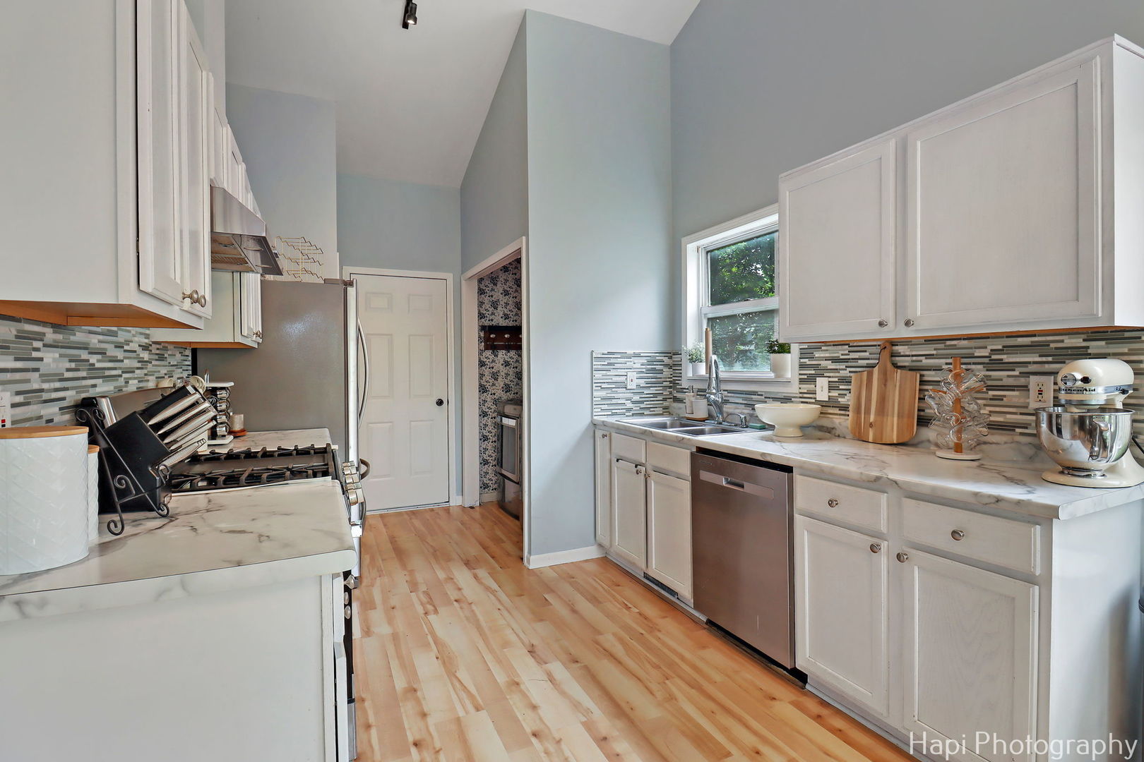 1504 9th Street Harvard, IL 60033 - Photo 7 of 24 a kitchen with stainless steel appliances granite countertop a stove a sink dishwasher and a refrigerator
