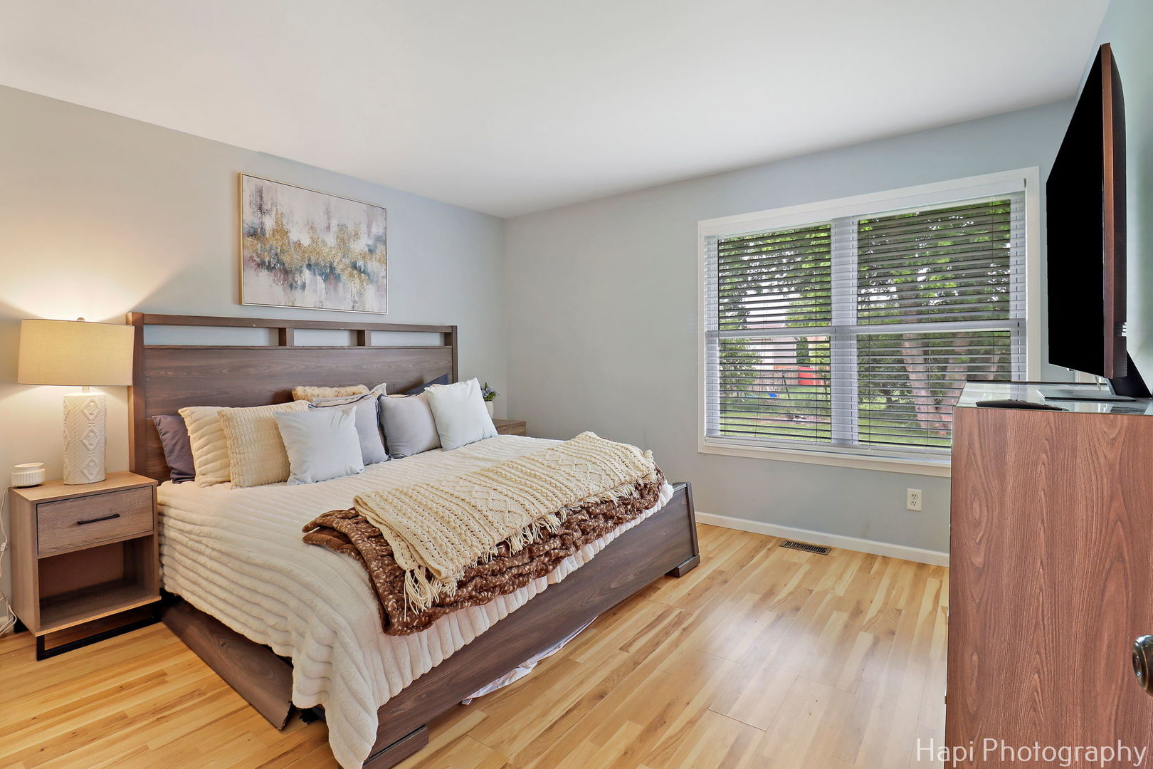 1504 9th Street Harvard, IL 60033 - Photo 9 of 24 a bedroom with a bed and wooden floor