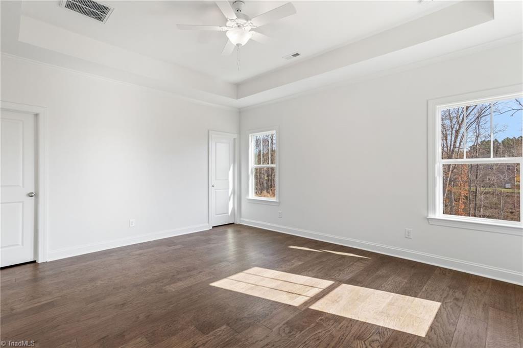 1675 Ashmead Lane Clemmons, NC 27012 - Photo 19 of 47 Tray Ceiling in Primary Bedroom on Main Level