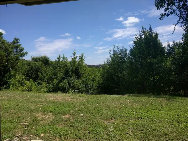 a view of an outdoor space and a yard