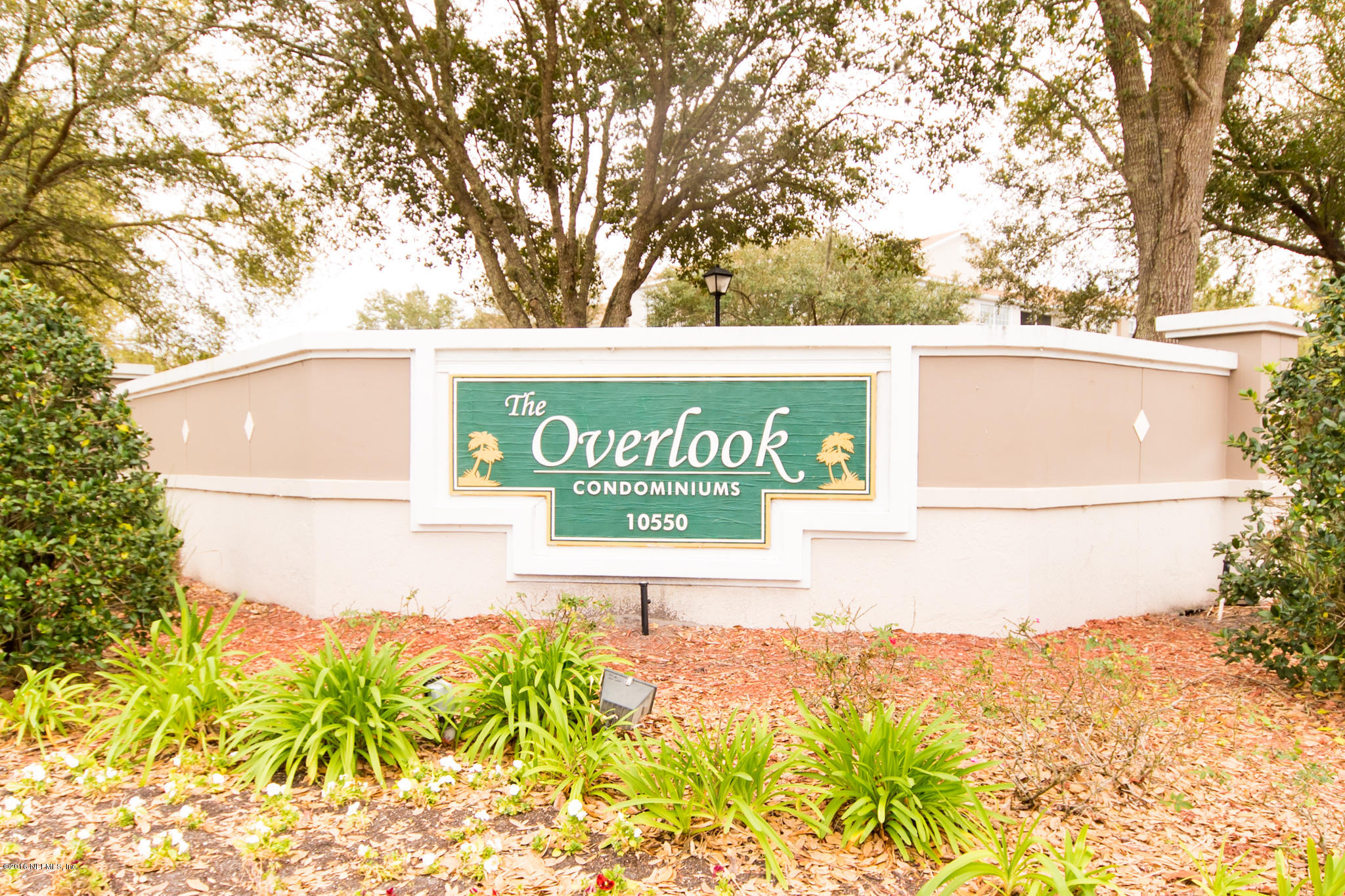 10550 Baymeadows Road, Unit 1010 Jacksonville, FL 32256 - Photo 2 of 32 a sign that is on the side of a road