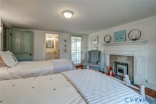 a bed room with a bed and a fireplace