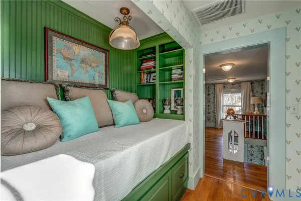 a spacious bedroom with a bed and a window