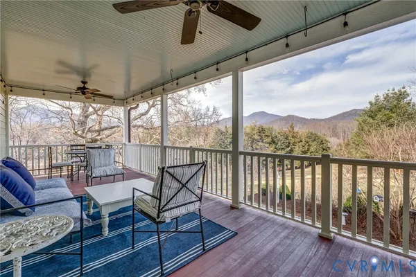 a view of a balcony with furniture
