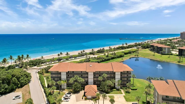 an aerial view of a house with a ocean view