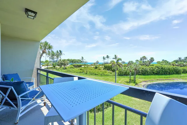 a view of a chairs and table on the deck
