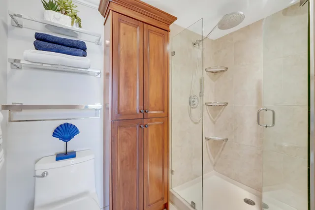 a bathroom with a shower and a sink