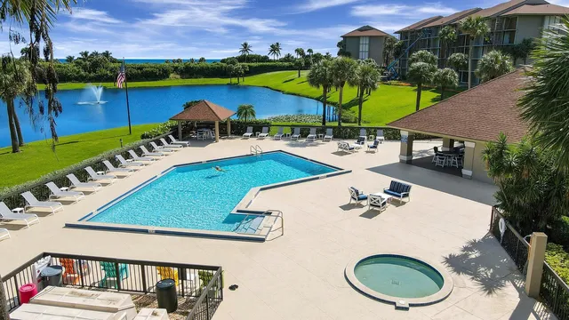 an aerial view of a house with swimming pool garden and patio