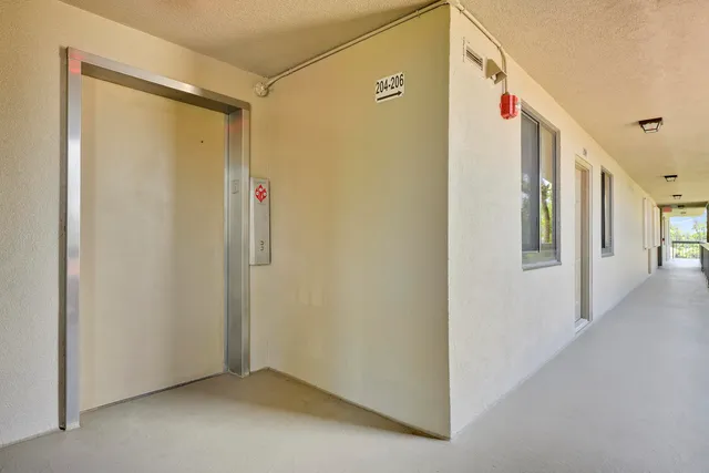a view of a hallway with closet area