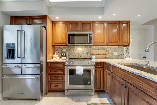 a kitchen with a refrigerator sink and microwave