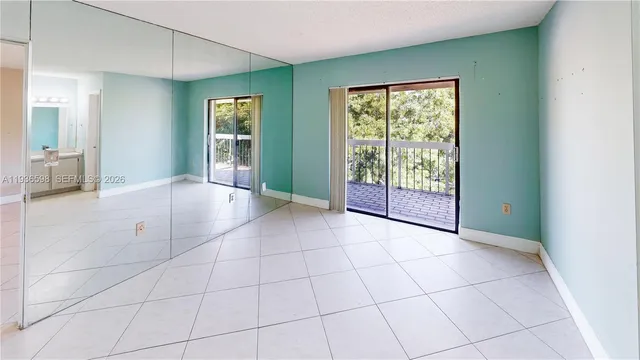 an aerial view of residential houses with outdoor space and swimming pool