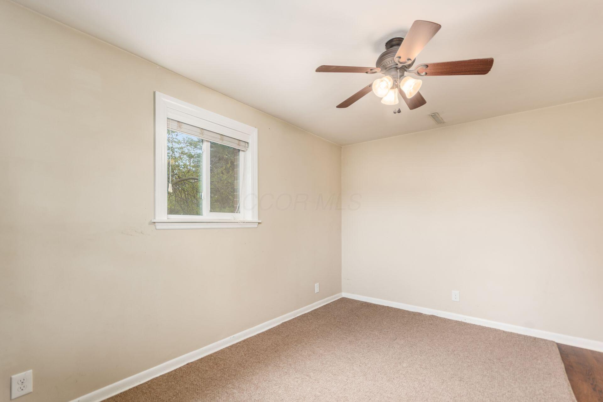 9221 London Road Orient, OH 43146 - Photo 11 of 51 First Floor Bedroom/Office with large window and overhead fan measuring 10'9" x 14'9"