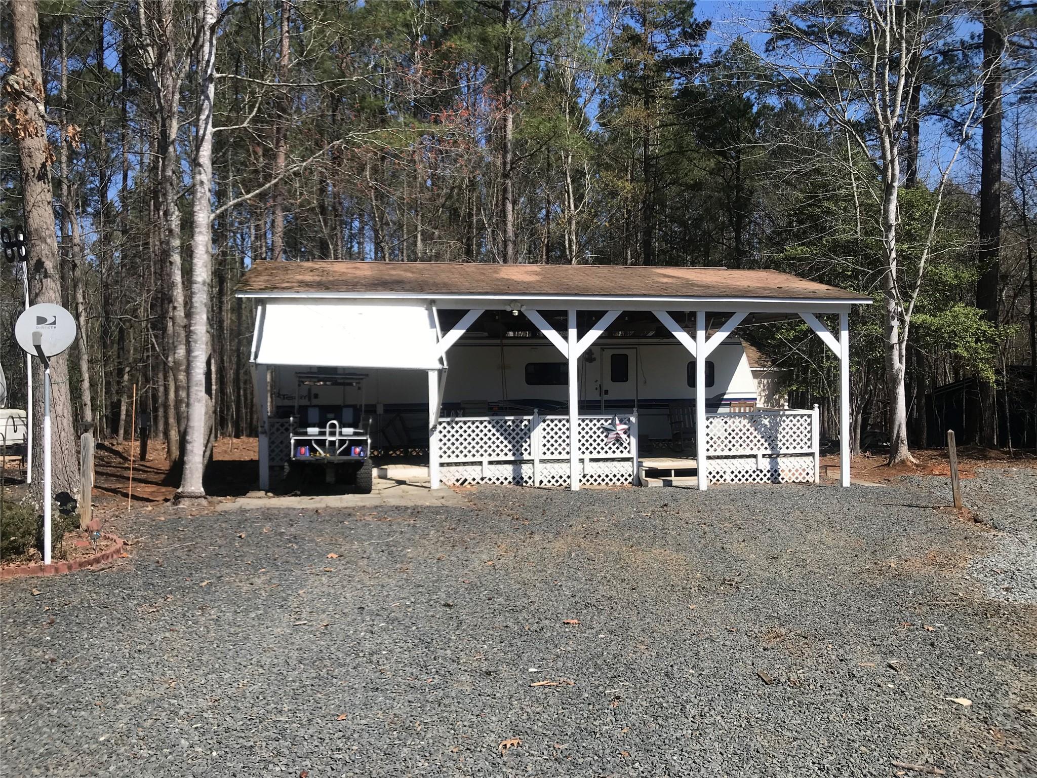150 Roberts Ridge Road, Unit H48 Mount Gilead, NC 27306 - Photo 1 of 35 a view of house with outdoor space and parking